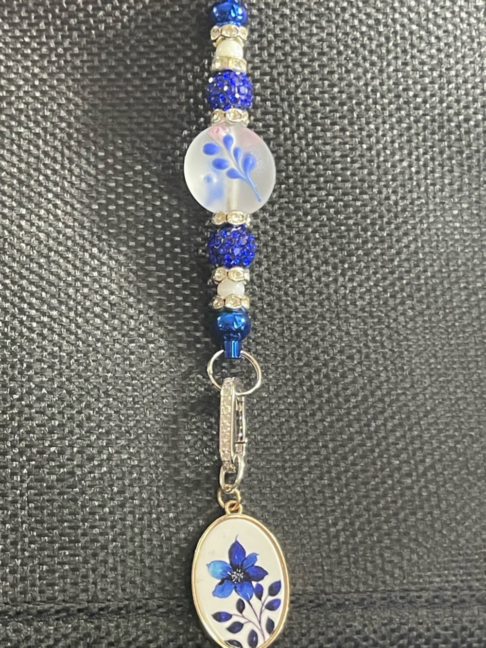 Handcrafted Blue Floral Pendant Bracelet with Beaded Accents
